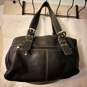 Woman’s purse with three pockets inside and a couple of little ones gently used